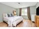 Cozy bedroom featuring a ceiling fan, natural light, and a calm paint color at 655 Powder Horn Ln, Indian Trail, NC 28079