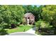 Beautiful two-story brick home with a manicured lawn and inviting walkway to a light blue front door at 655 Powder Horn Ln, Indian Trail, NC 28079