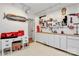 Organized garage space with pegboard, work bench, tool storage, and a decorative mounted marlin at 655 Powder Horn Ln, Indian Trail, NC 28079