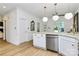 Open kitchen with white cabinetry, stainless steel appliances, and a central island with bar seating at 655 Powder Horn Ln, Indian Trail, NC 28079