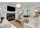 Bright living room featuring a fireplace and hardwood floors at 655 Powder Horn Ln, Indian Trail, NC 28079