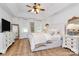 Bright bedroom with vaulted ceiling, stylish decor, a sitting area, and natural light at 655 Powder Horn Ln, Indian Trail, NC 28079