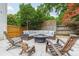 Cozy outdoor living area with a fire pit and comfortable seating arrangement at 6621 Ronda Ave, Charlotte, NC 28211