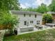Open patio area with an outdoor kitchen, seating, and dining space at 6621 Ronda Ave, Charlotte, NC 28211