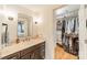 Stylish bathroom with a modern vanity, updated fixtures, and access to a walk-in closet at 6621 Ronda Ave, Charlotte, NC 28211