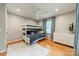 Bedroom featuring a bunk bed, light-colored walls, and wood flooring at 6621 Ronda Ave, Charlotte, NC 28211