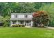 Charming home featuring a well-manicured lawn, mature trees, and attractive curb appeal at 6621 Ronda Ave, Charlotte, NC 28211