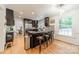 Well-equipped kitchen with stainless steel appliances, granite counters, and breakfast bar seating at 6621 Ronda Ave, Charlotte, NC 28211