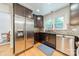 Spacious kitchen featuring stainless steel appliances, ample counter space, and natural light at 6621 Ronda Ave, Charlotte, NC 28211