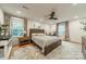 Spacious main bedroom features hardwood floors, natural light, and a cozy atmosphere at 6621 Ronda Ave, Charlotte, NC 28211