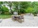 Elegant outdoor dining setup on a spacious patio with lush surroundings at 6621 Ronda Ave, Charlotte, NC 28211