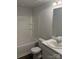 Clean, well-lit bathroom with a white tub, vanity, and sleek fixtures at 7 Scott Sw St, Concord, NC 28025