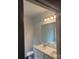 Bathroom featuring a double vanity with a large mirror, toilet, and natural light at 7 Scott Sw St, Concord, NC 28025