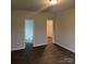 Bedroom featuring two entryways, one to a closet and the other to a bathroom, enhancing convenience and accessibility at 7 Scott Sw St, Concord, NC 28025