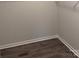 Close up of the corner of an empty closet showing the base molding and the flooring at 7 Scott Sw St, Concord, NC 28025
