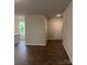Welcoming entryway with hardwood floors that leads to the rest of the home at 7 Scott Sw St, Concord, NC 28025