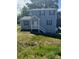 Charming two-story home with blue siding, white trim, and a welcoming front porch at 7 Scott Sw St, Concord, NC 28025