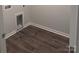 The Laundry room with vinyl flooring and washer dryer hookups at 7 Scott Sw St, Concord, NC 28025