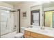 Functional bathroom with shower-tub combination, vanity, and convenient in-unit washer and dryer at 715 N Church St # 613, Charlotte, NC 28202
