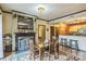 Dining room featuring a cozy fireplace, hardwood floors, and an open layout with the kitchen at 715 N Church St # 613, Charlotte, NC 28202