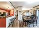 Bright dining room with views into the kitchen, living spaces, and balcony at 715 N Church St # 613, Charlotte, NC 28202