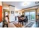 Spacious dining room with hardwood floors, a modern light fixture, and an open layout at 715 N Church St # 613, Charlotte, NC 28202