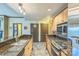 Functional kitchen with stainless steel appliances, granite countertops, and easy access to other rooms at 715 N Church St # 613, Charlotte, NC 28202