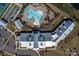 Aerial view of community amenities with a large clubhouse, pool, and landscaping at 7332 Jolly Brook Dr, Charlotte, NC 28215