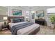 Comfortable bedroom with neutral tones, bright windows and stylish decor at 7332 Jolly Brook Dr, Charlotte, NC 28215