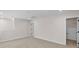 Bonus room featuring neutral carpeting and paint and two doorways leading to other spaces at 7332 Jolly Brook Dr, Charlotte, NC 28215