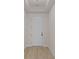 Entryway featuring light wood floors, white trim, door, and ceiling trim detail at 7332 Jolly Brook Dr, Charlotte, NC 28215