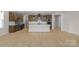 A modern kitchen with stainless appliances, white subway tile, pendant lights, and an island at 7332 Jolly Brook Dr, Charlotte, NC 28215