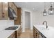 Contemporary kitchen featuring stainless appliances, a sleek range hood, and bright countertops at 7332 Jolly Brook Dr, Charlotte, NC 28215