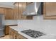 Bright kitchen with stainless steel appliances, gas range, white subway tile, and quartz countertops at 7332 Jolly Brook Dr, Charlotte, NC 28215