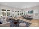 Bright open-plan living room with dining area, large windows, and modern décor at 7332 Jolly Brook Dr, Charlotte, NC 28215