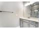 Neutral bathroom with light gray cabinets, white quartz countertops, and shower with marble tile surround at 7517 Lancaster Hwy # 5, Waxhaw, NC 28173