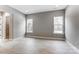 Spacious bedroom offers wood-look floors and two large windows at 7517 Lancaster Hwy # 5, Waxhaw, NC 28173