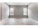 Bedroom featuring wood-look flooring and two large windows at 7517 Lancaster Hwy # 5, Waxhaw, NC 28173