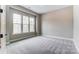 Bright bedroom with plush carpeting, neutral walls, and abundant natural light from the three large windows at 7517 Lancaster Hwy # 5, Waxhaw, NC 28173
