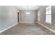 Elegant dining room with light hardwood floors, ample natural light, and a stylish chandelier at 7517 Lancaster Hwy # 5, Waxhaw, NC 28173
