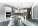 Modern eat-in kitchen featuring white cabinets, stainless steel appliances, and a kitchen island at 7517 Lancaster Hwy # 5, Waxhaw, NC 28173