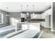 Eat-in kitchen with white cabinets, stainless steel appliances, and a kitchen island at 7517 Lancaster Hwy # 5, Waxhaw, NC 28173