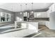 Eat-in kitchen with white cabinets, stainless steel appliances, and a kitchen island at 7517 Lancaster Hwy # 5, Waxhaw, NC 28173