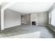 Bright living room with a fireplace and light colored vinyl flooring at 7517 Lancaster Hwy # 5, Waxhaw, NC 28173