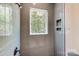 Modern tiled shower with niche and a window at 7517 Lancaster Hwy # 5, Waxhaw, NC 28173