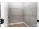 Spacious walk-in closet featuring wire shelving and wood-look flooring at 7517 Lancaster Hwy # 5, Waxhaw, NC 28173