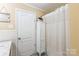 Bathroom featuring a shower with a curtain, and neutral colored walls and door at 814 Rhodann Dr, Shelby, NC 28152