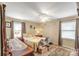 Bedroom with neutral walls, curtains, a ceiling fan, and multiple dressers and cabinets at 814 Rhodann Dr, Shelby, NC 28152