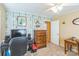 Well-lit bedroom features a desk, dresser, blue accent wall and ceiling fan at 814 Rhodann Dr, Shelby, NC 28152
