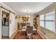 Dining room with a glass-top table, wicker chairs, and sliding barn door at 814 Rhodann Dr, Shelby, NC 28152
